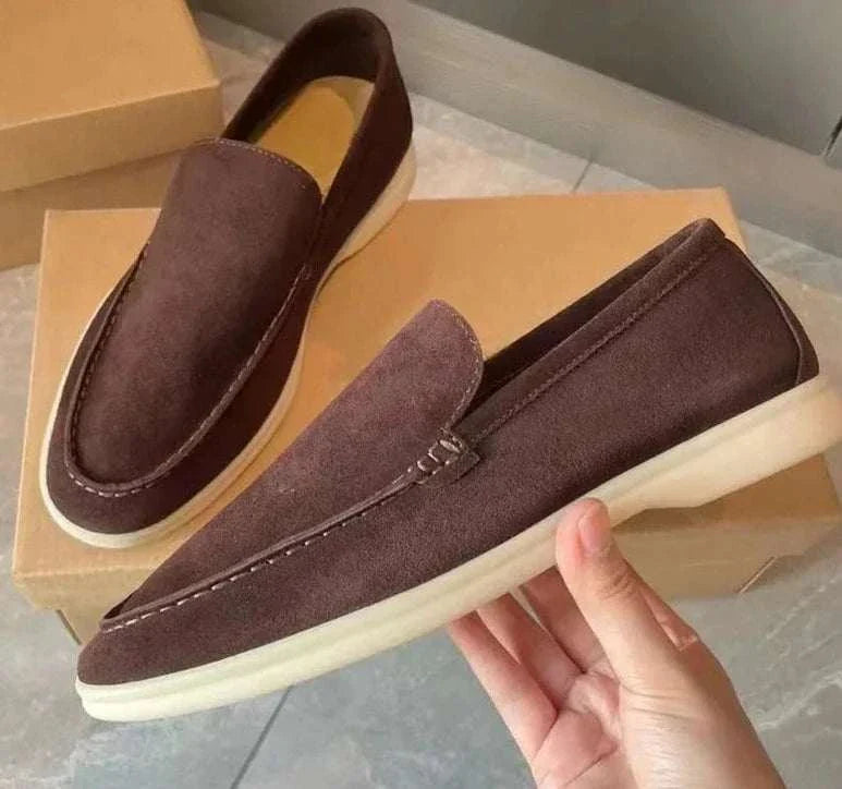 Suede elegant loafers in soft sheep leather, displayed on shoe boxes.