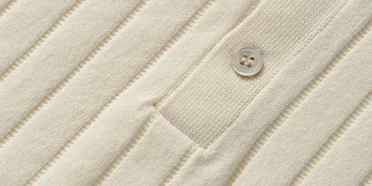 Close-up of a vintage business cotton summer t-shirt with button detail and ribbed texture.