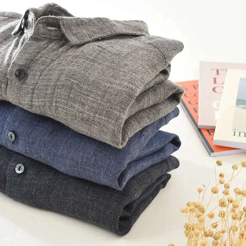 Stack of three summer pure linen shirts in various solid colors suitable for spring and summer.
