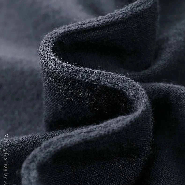 Close-up of soft, textured fabric of Antonios wool polo sweater, showcasing wool and cotton blend.