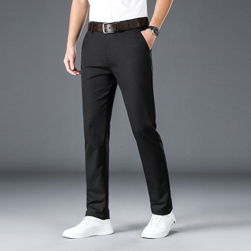 Man wearing Antonios Stretch Pants in black for a casual or elegant men's outfit, featuring a full-length design made from polyester.