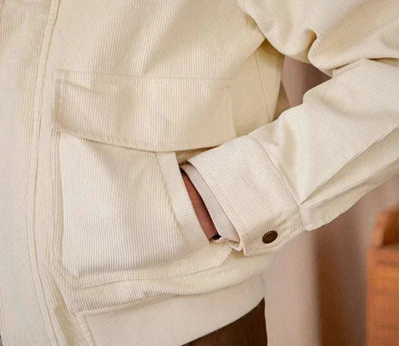 Pure cotton bomber jacket, close-up of soft, breathable fabric with pocket detail.