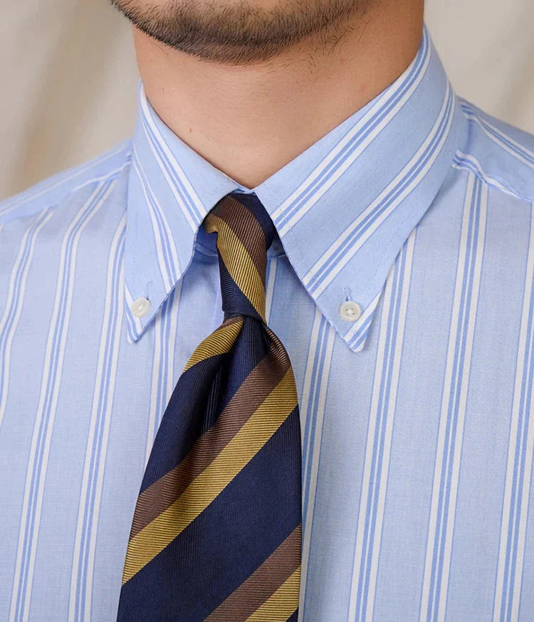Business stripe all long sleeve shirt in blue and white with brown and navy striped tie.