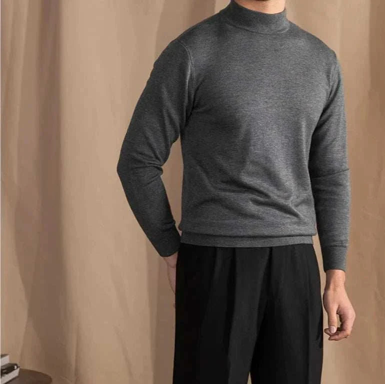 Antonios slim fit half-turtleneck sweater in grey worn by a man.