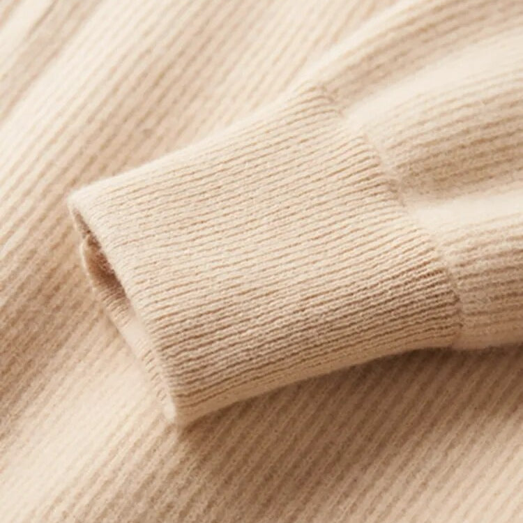 Pure Wool Cardigan with ribbed cuff and soft texture.