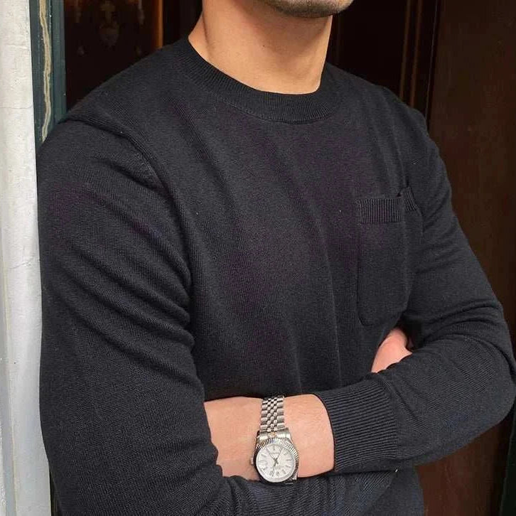 Man wearing Antonios office premium sweater in black with watch, cozy and perfect fitting for business settings.