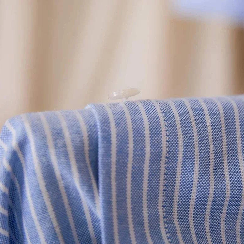 Antonios striped cotton business shirt fabric detail with button.