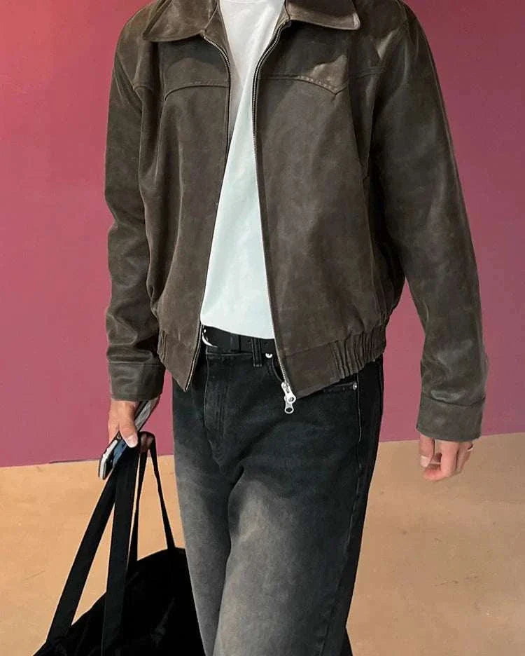 Autumn vintage PU leather jacket for men in brown, styled casually with jeans.