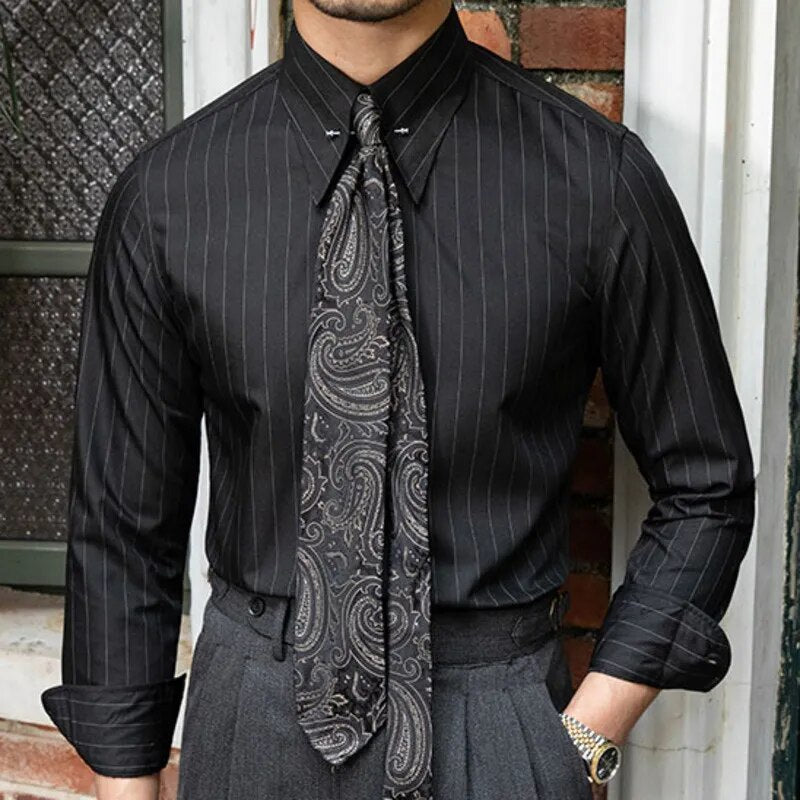 Long sleeve black shirt with subtle stripes and a paisley tie, ideal for smart casual outfits.
