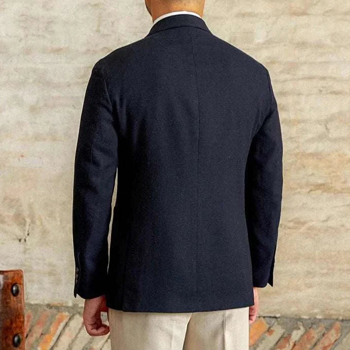 Slim fit cotton-linen blend jacket in navy, rear view, stylish men's attire.