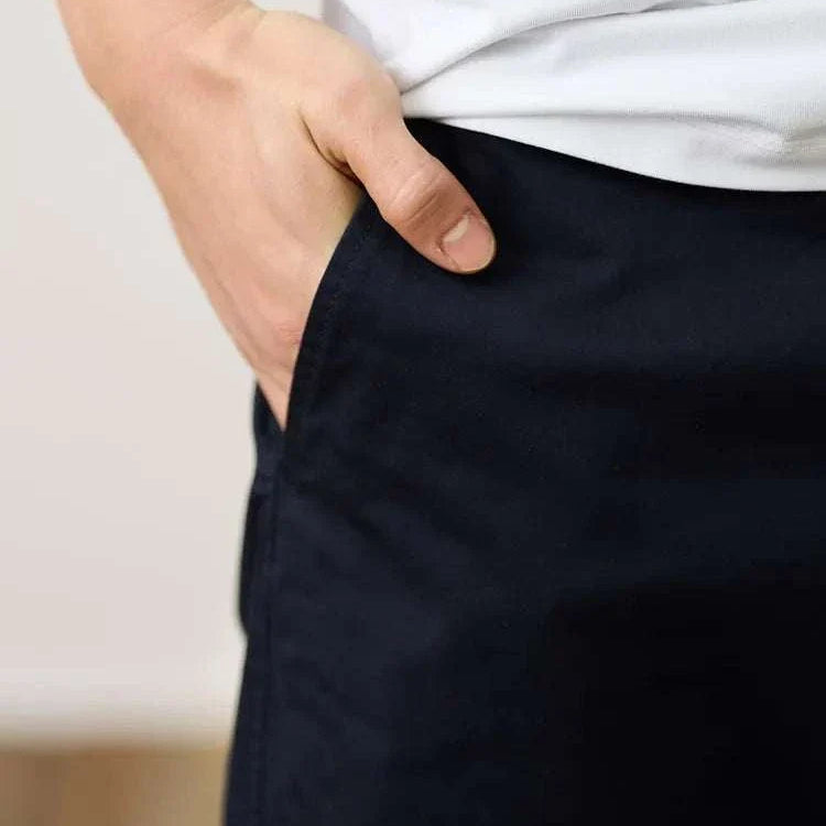 Classic chino pants with hand in pocket, comfortable cotton and spandex blend, suitable for casual or smart casual wear.