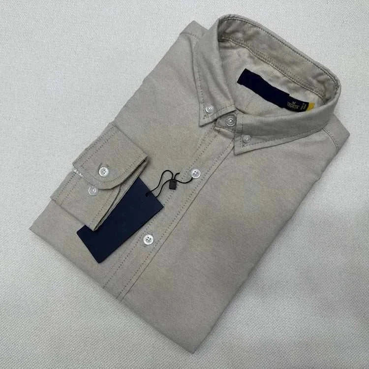 Oxford business casual long sleeve cotton shirt folded neatly with a tag attached.