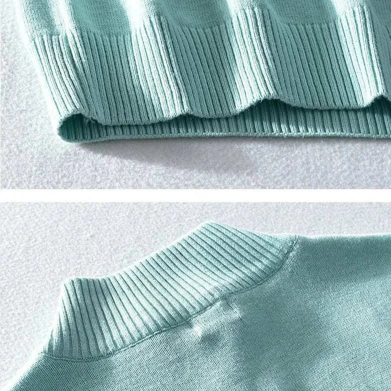 Autumn half zipper cotton sweater in light green ribbed fabric close-up.