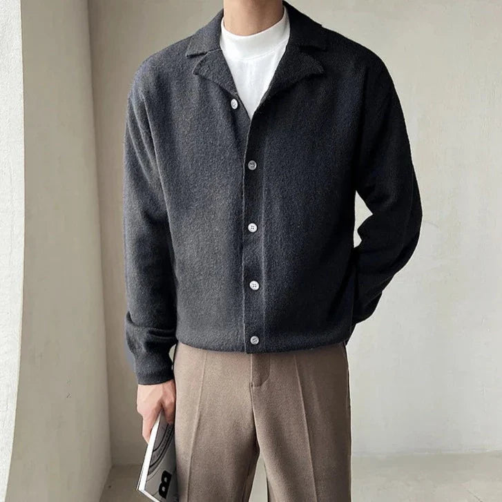 Oxford fall cardigan on man, offering comfort and warmth, ideal for layering. Available in brown, white, and black.