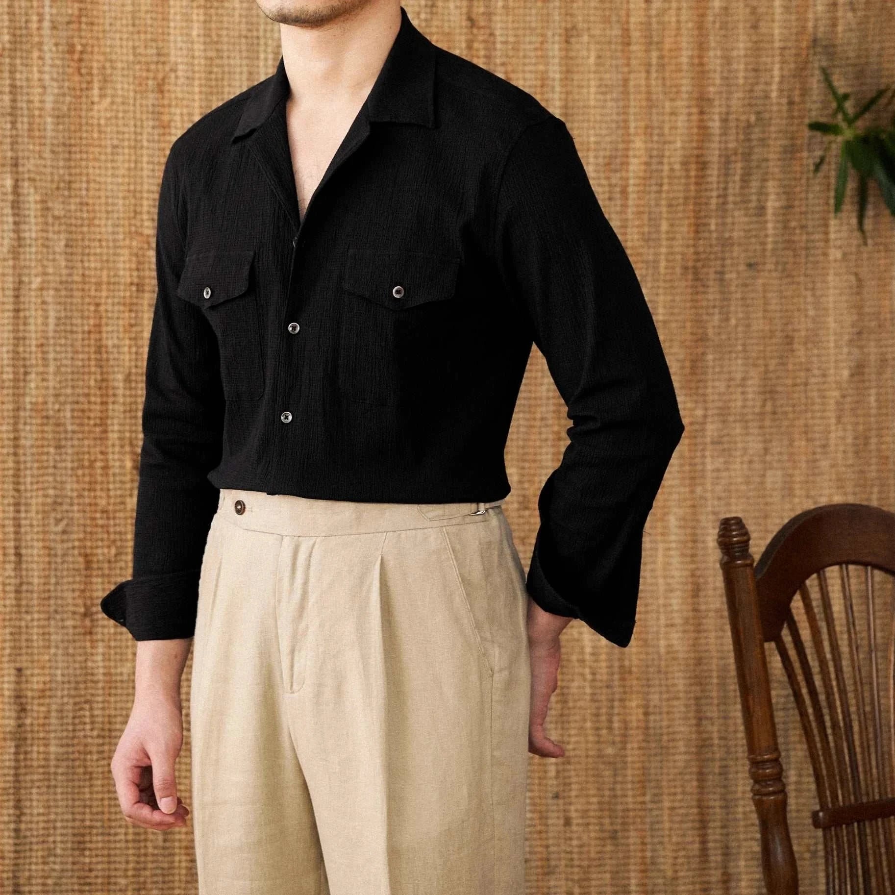 Cuban collar relaxed fit elegant shirt for men in solid black cotton fabric.