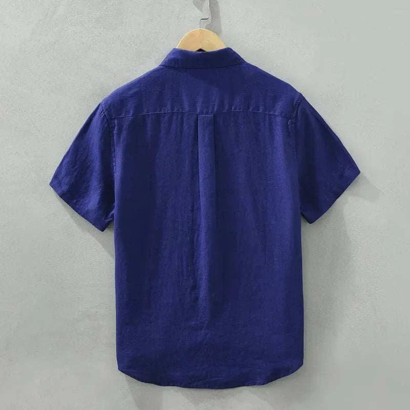 Men's short sleeve blue summer shirt on hanger.