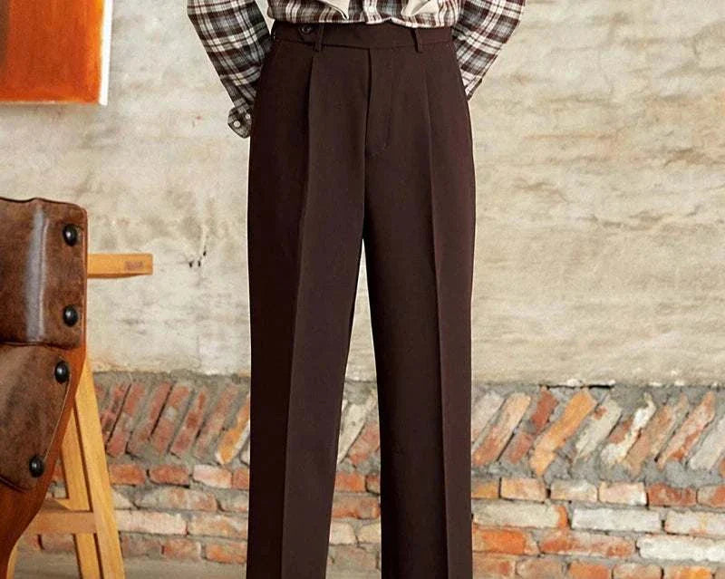 Italian straight style elegant pants in polyester fabric displayed against a rustic background.