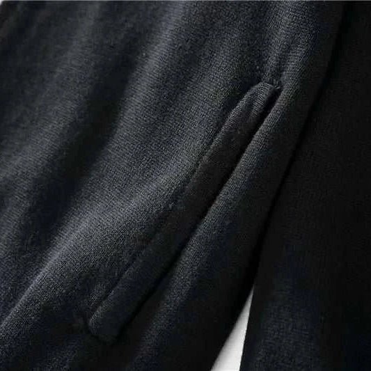 Cold season casual cardigan in black cotton fabric, close-up view.