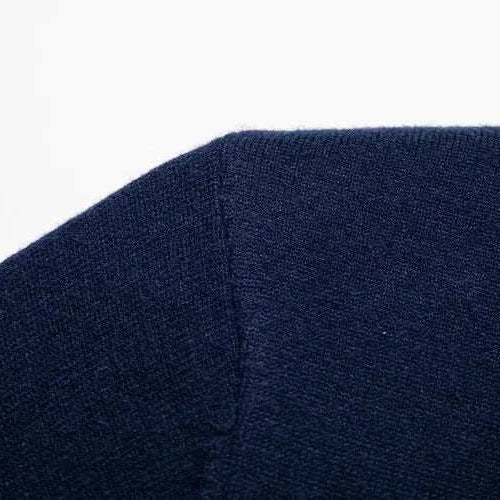 Close-up of Antonios polo sweater with buttons in navy fabric.