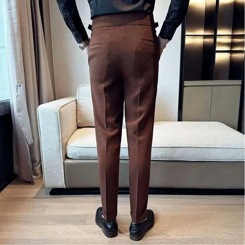 Stylish brown formal office pants for men in elegant setting.
