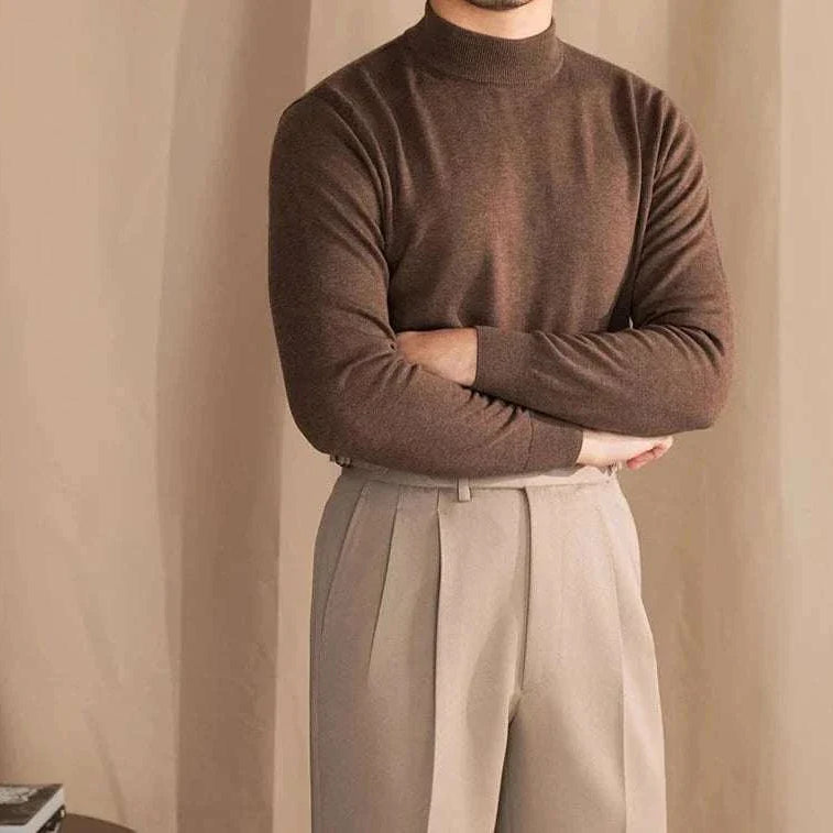 Man wearing a brown Antonios slim fit half-turtleneck sweater and beige trousers.