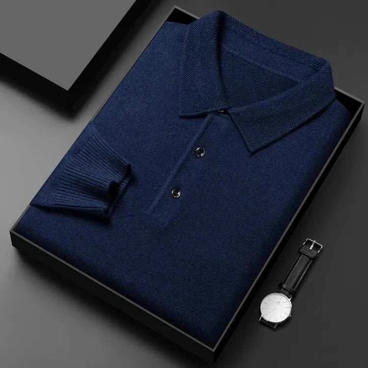 Antonios polo sweater with buttons in navy blue, folded neatly with accessories.