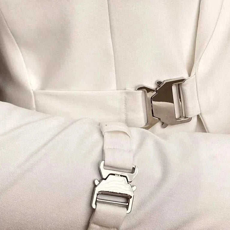 Elegant slim fit suit jacket with stylish metal clasp detail.