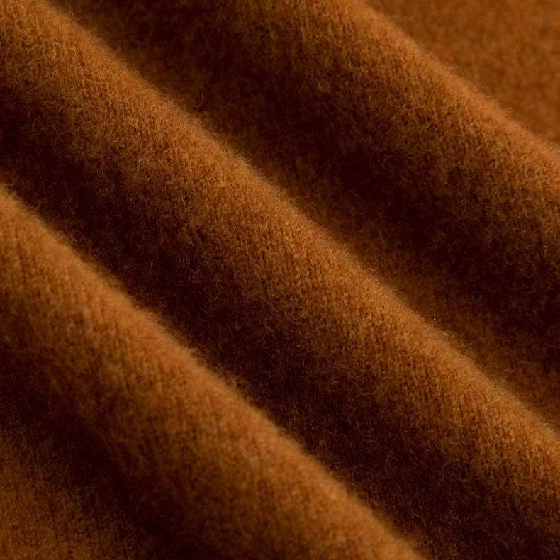 Brown wool fabric texture of business turtleneck sweater.