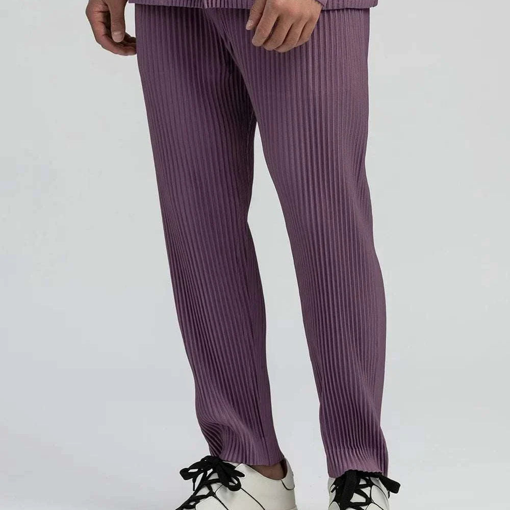 Baggy relaxed fit casual trousers in solid polyester fabric, suitable for smart casual wear.
