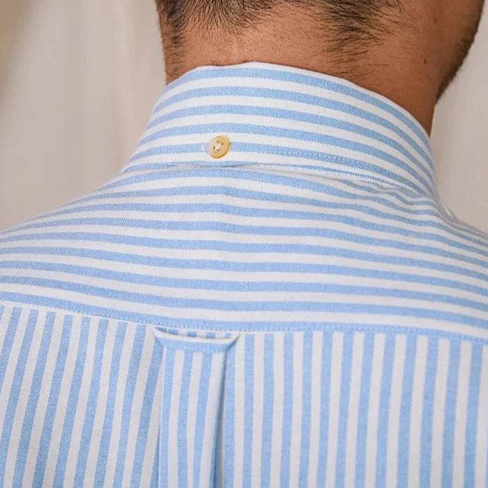 Oxford style casual cotton shirt with blue and white stripes, button detail on the back of the collar.
