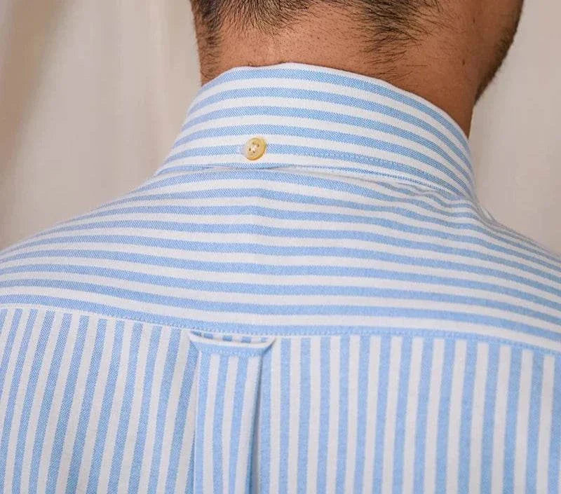 Oxford style casual cotton shirt with blue and white stripes, button detail on the back of the collar.