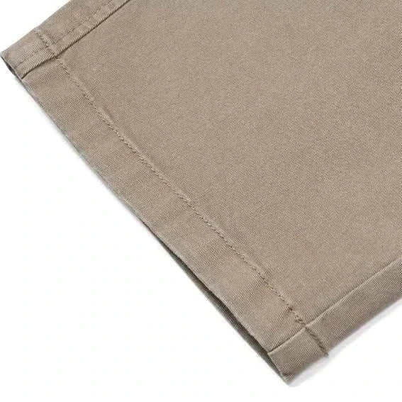 Classic chino pants hem detail showing cotton-spandex fabric blend.