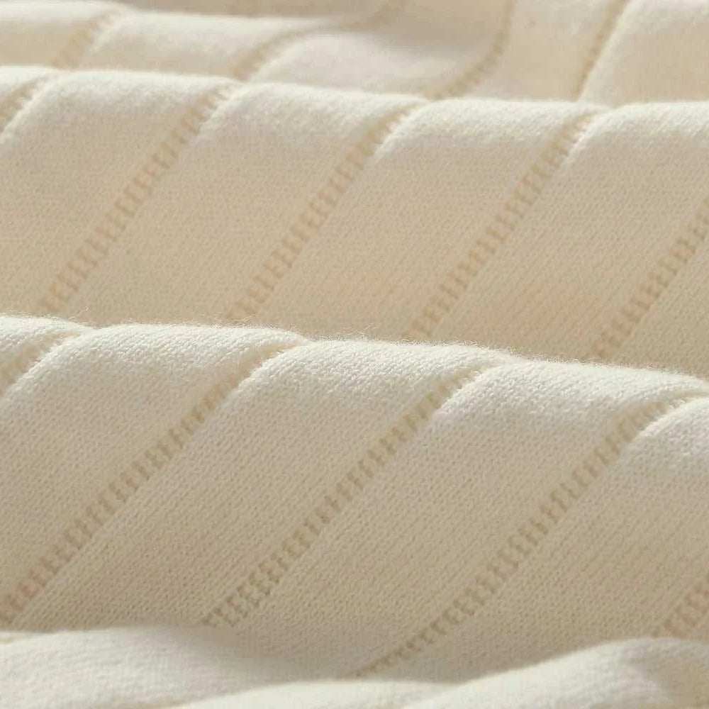 Close-up of soft, textured cotton fabric in cream, showcasing the material of a vintage business cotton summer t-shirt.