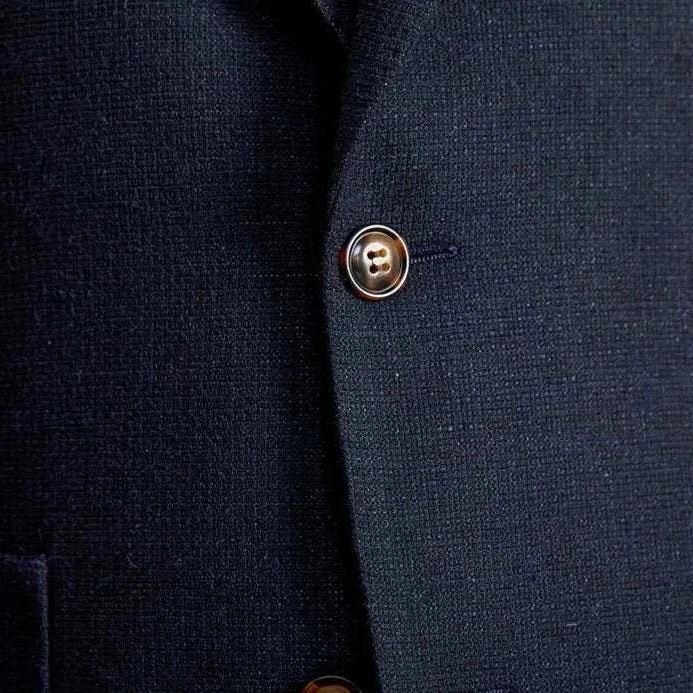 Slim fit cotton-linen blend jacket with buttons detail.