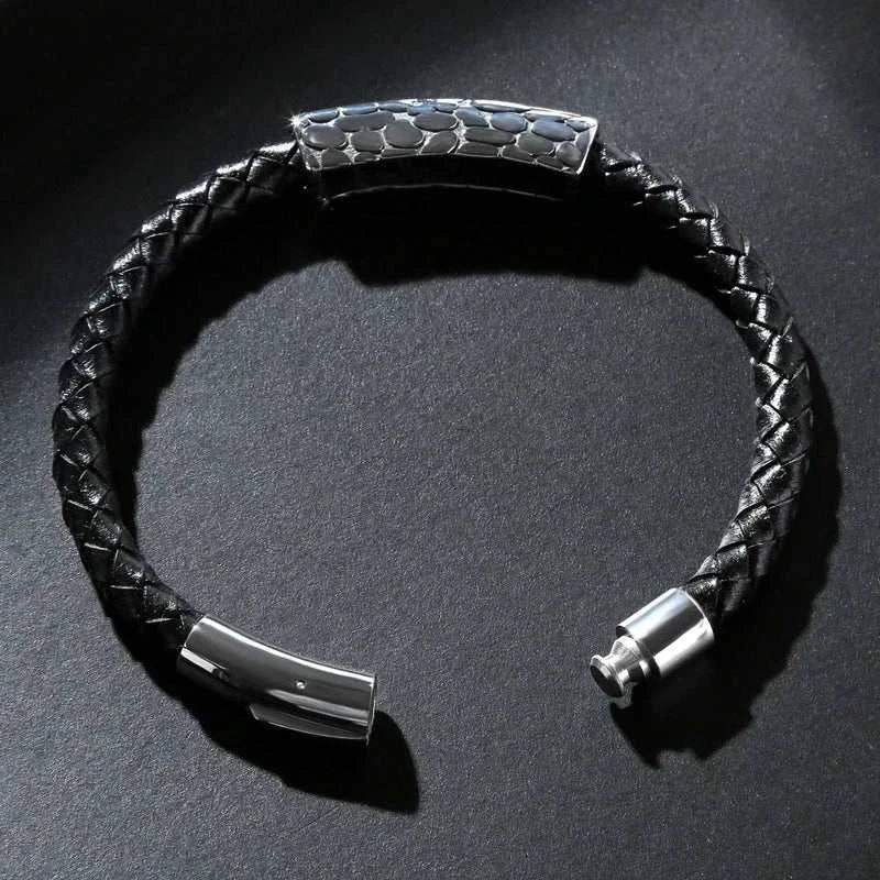 Genuine leather braided bracelet with stainless steel clasp, showcasing rugged elegance.