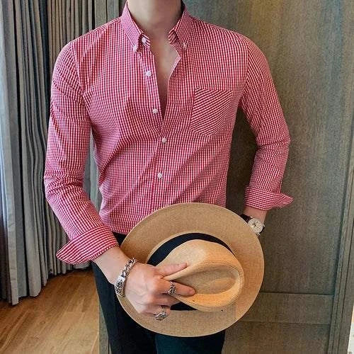 Cotton long sleeve plaid shirt in red with button-down design, shown on a person holding a hat.