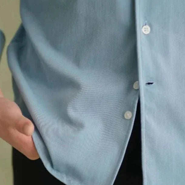 Spring pointer collar long sleeve shirt in light blue, close-up.