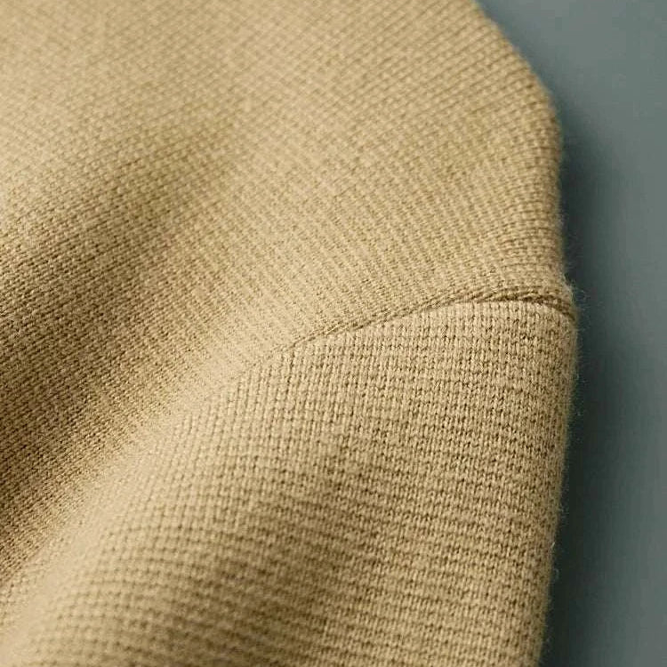 Close-up of Antonios wool polo collar cardigan fabric detail, showcasing its textured knit design.