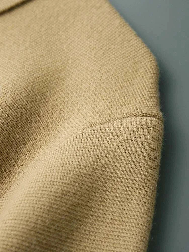 Close-up of Antonios wool polo collar cardigan fabric detail, showcasing its textured knit design.