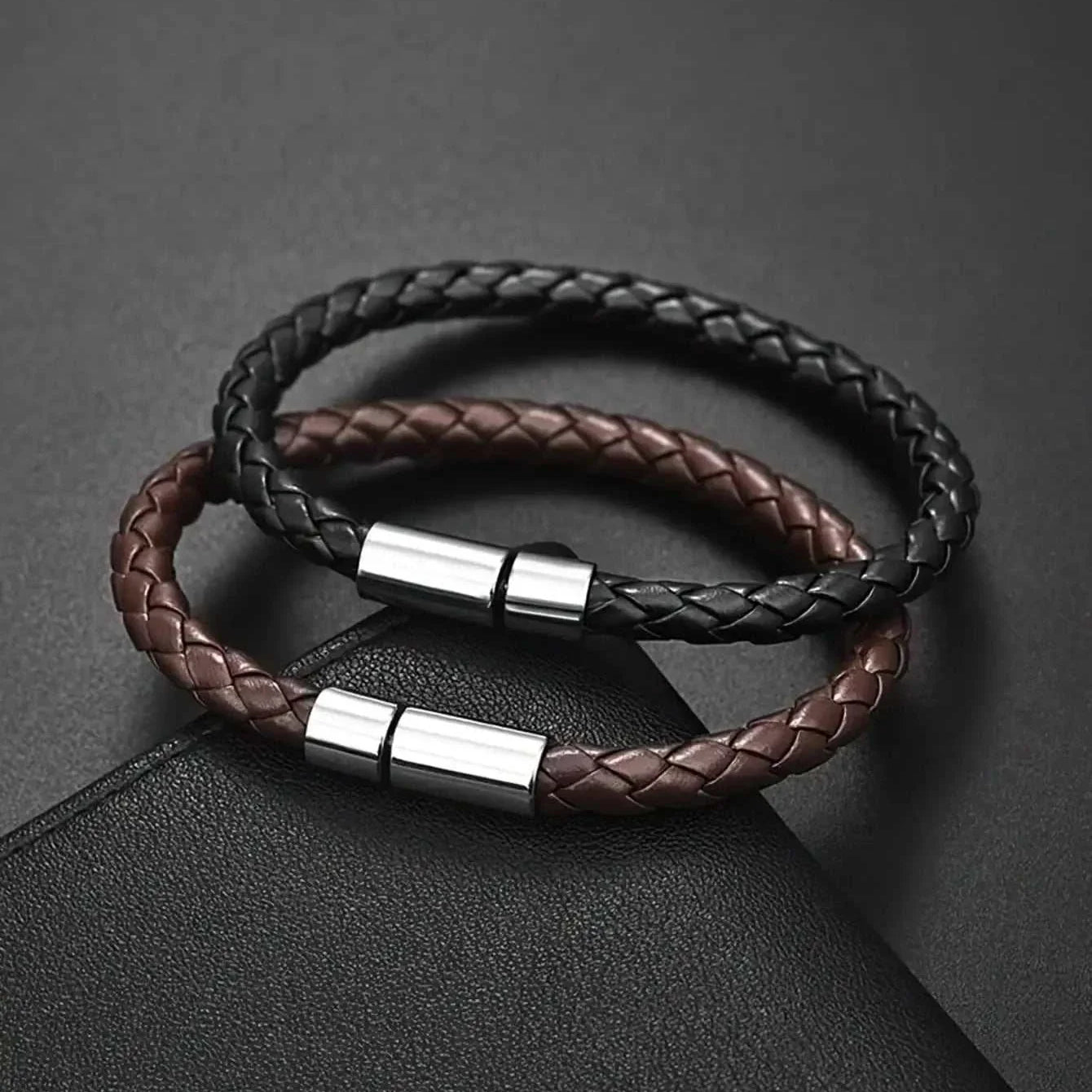 Business PU leather bracelet in black and brown with sleek metal clasps, perfect for professional settings.