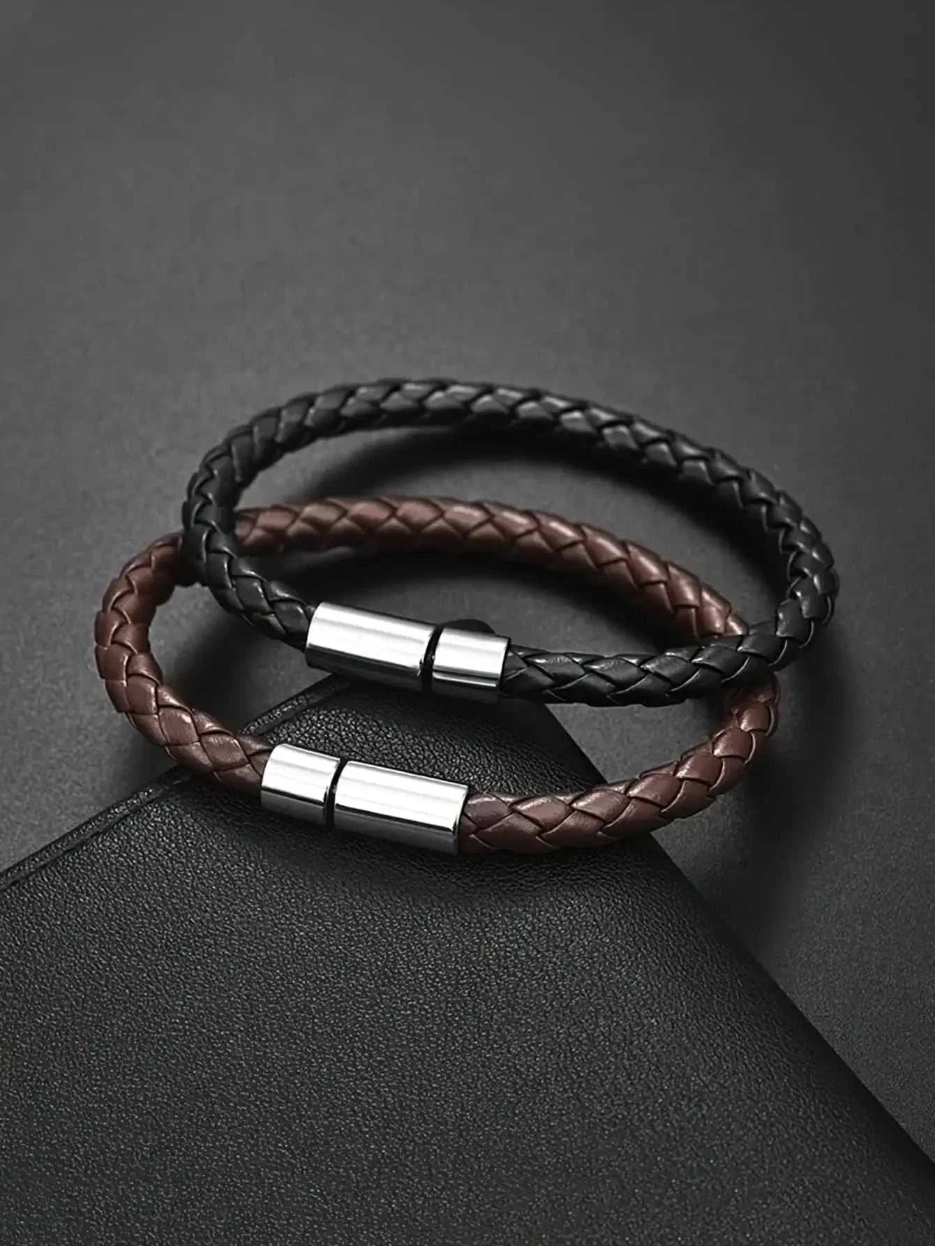 Business PU leather bracelet in black and brown with sleek metal clasps, perfect for professional settings.