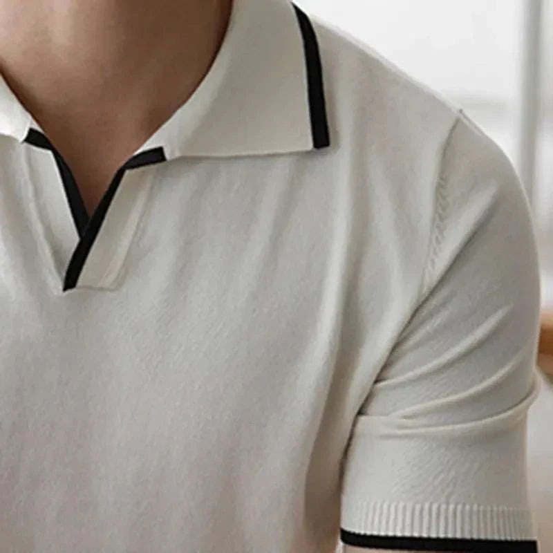 Knitted polo collar t-shirt in solid white with black trim, suitable for casual or office wear.