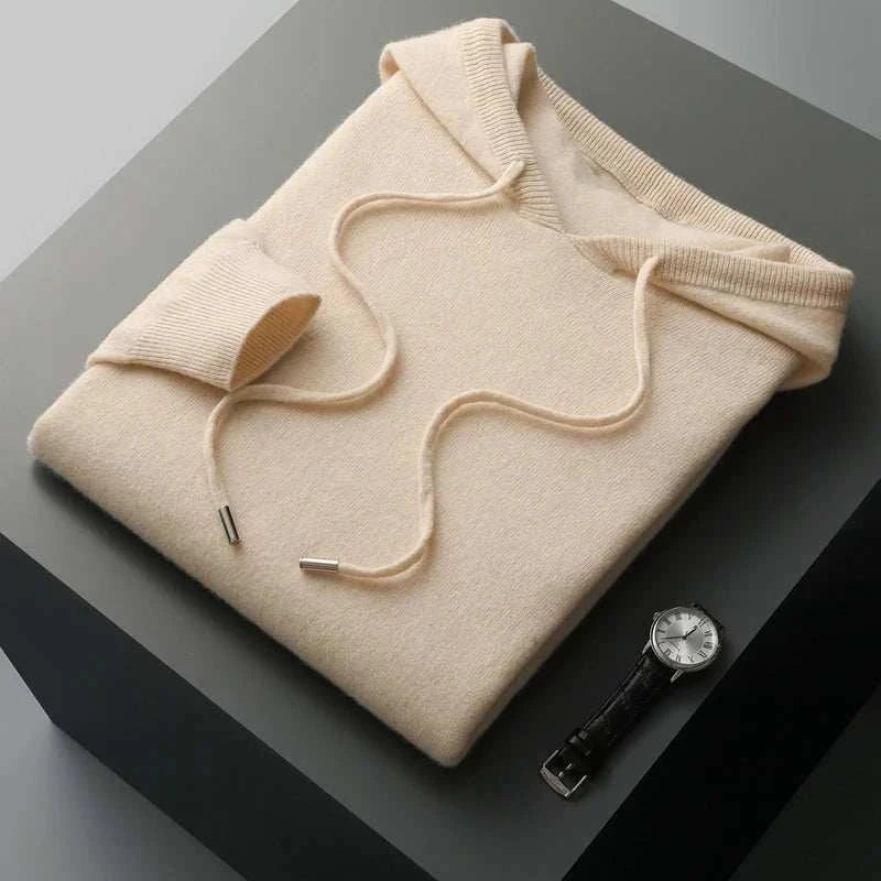 Men's wool cold season sweater, soft, high-quality material, folded with a wristwatch beside it.