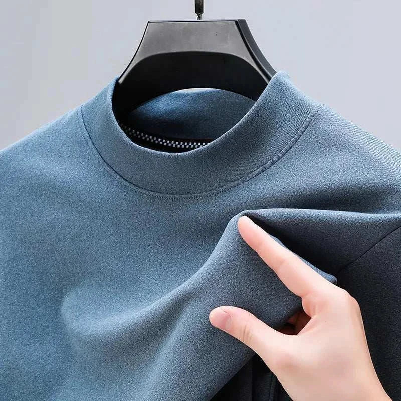 Blue classic turtleneck sweater made from cotton for men, featuring a solid pattern and casual elegance.
