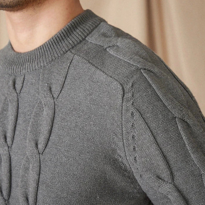 Round neck vintage sweater made of cotton and wool blend, close-up of knit design.