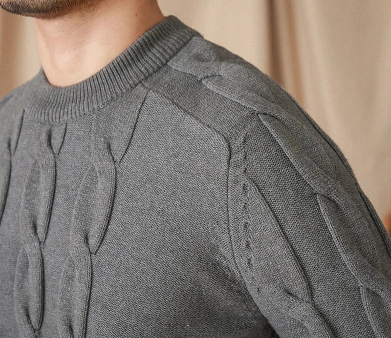 Round neck vintage sweater made of cotton and wool blend, close-up of knit design.