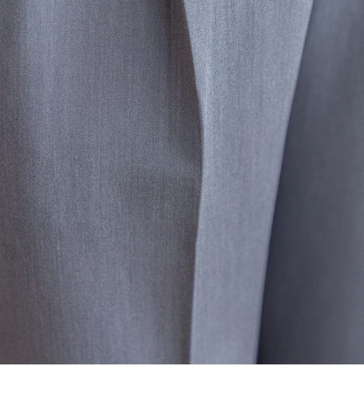 Close-up of high waist business trousers fabric showcasing fine texture.