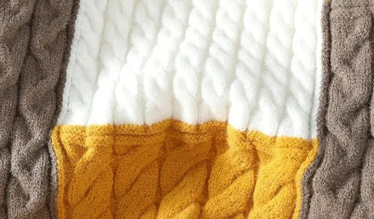 Norway neck sweater with textured knit pattern in brown, white, and yellow.