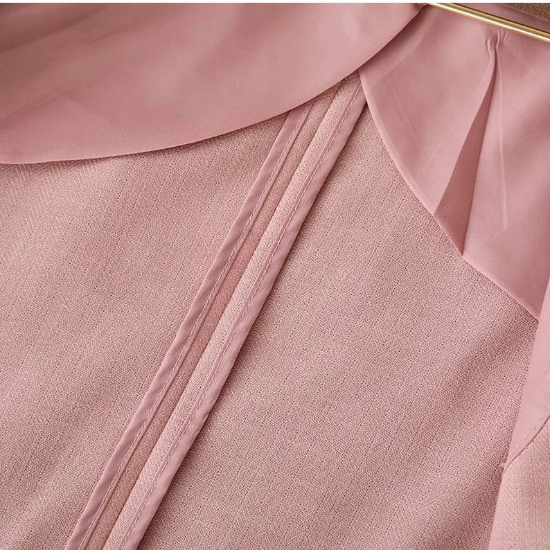 Close-up of Business linen relaxation jacket in pink polyester fabric.