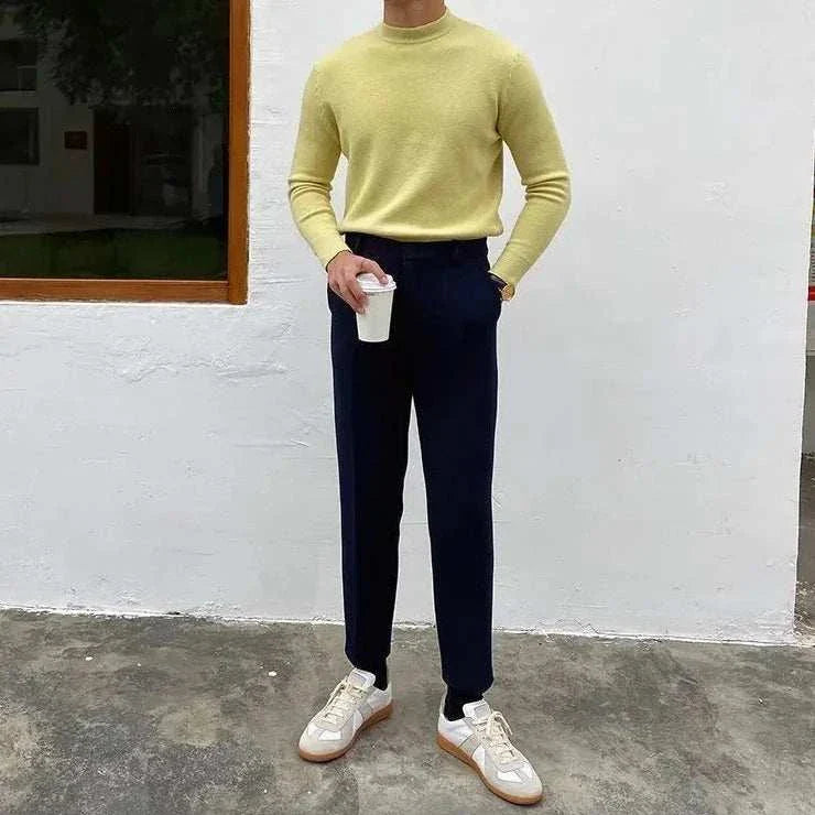 Korean smart casual sweater in apricot color, ideal for all seasons, featuring solid wool, modeled by a man holding a coffee cup.